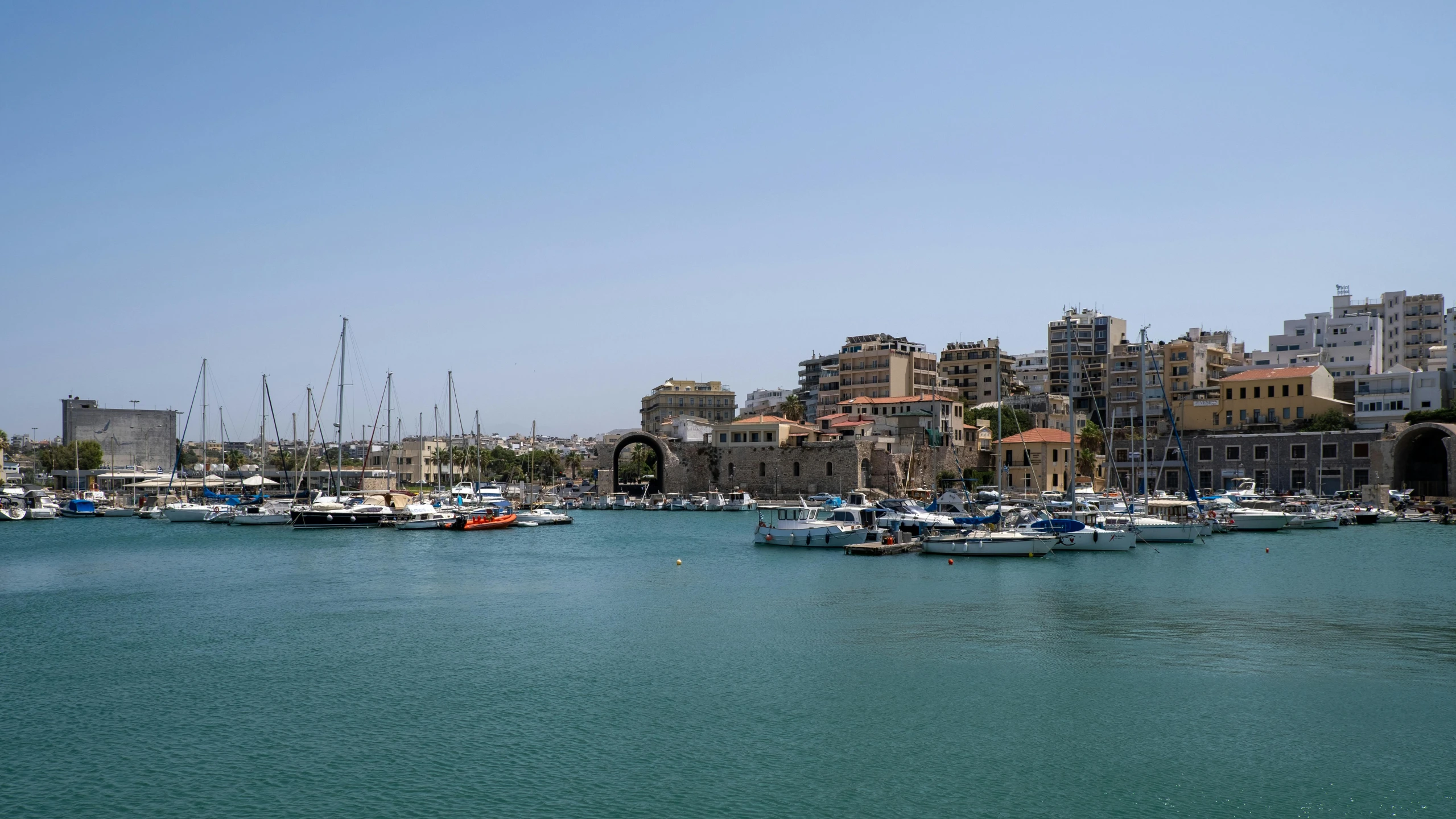 a large body of water filled with lots of boats, by Simon Marmion, pexels contest winner, greek nose, port city, low quality photo, hd footage