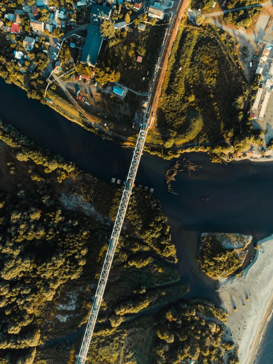 an aerial view of a bridge over a river, pexels contest winner, hurufiyya, thumbnail, small town surrounding, high contrast 8k, portrait shot