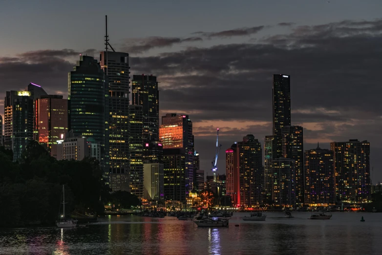 a large body of water with a city in the background, pexels contest winner, australian tonalism, multi - coloured, led, koyaanisqatsi, shot with sony alpha 1 camera