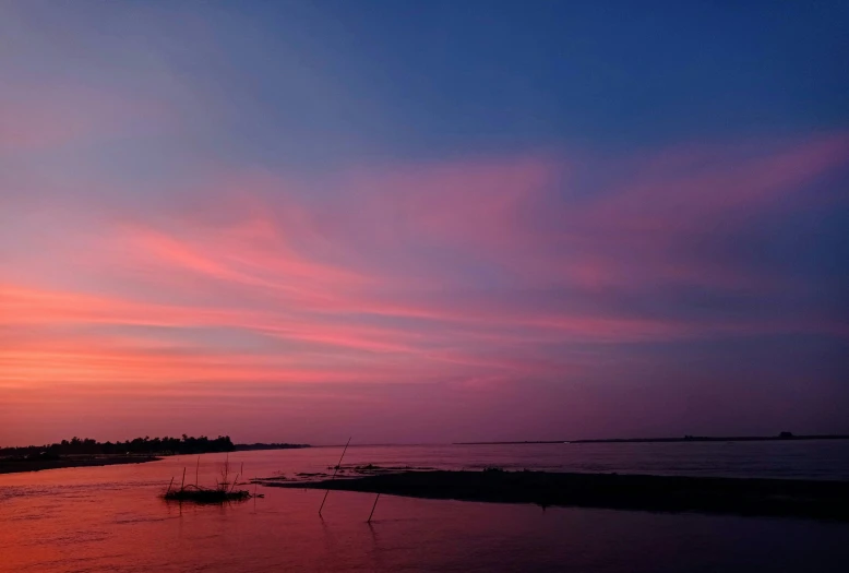 the sun is setting over a body of water, by Jan Tengnagel, pexels contest winner, romanticism, dayglo pink and blue, bangladesh, panorama view of the sky, slide show
