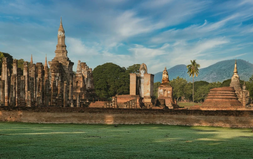 a large building sitting in the middle of a lush green field, inspired by Steve McCurry, renaissance, sukhothai costume, epic castle with tall spires, promo image, thumbnail