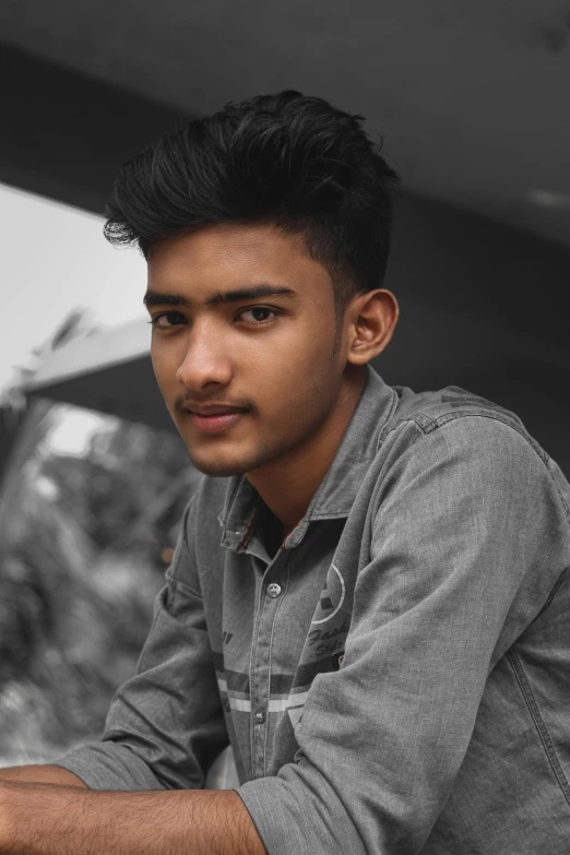 a man sitting in front of a laptop computer, by Max Dauthendey, pexels contest winner, realism, boyish face, assamese aesthetic, headshot profile picture, he is about 20 years old | short