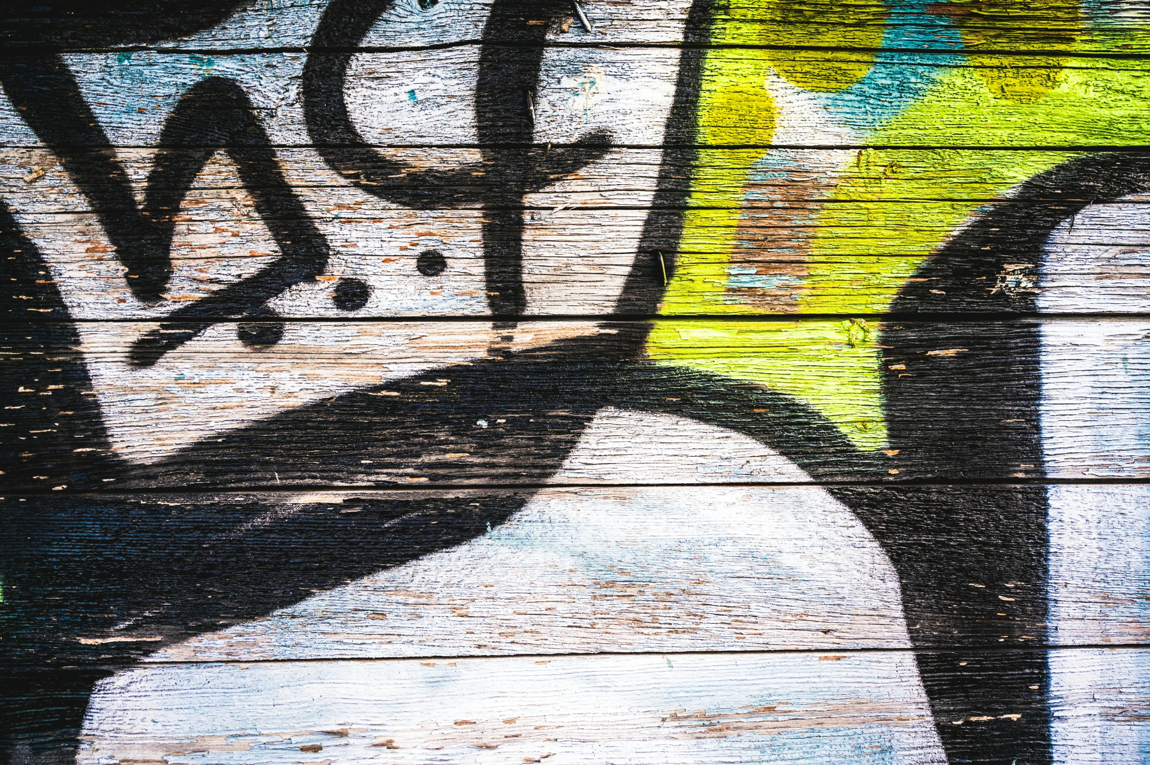 a close up of a piece of wood with graffiti on it, graffiti art, inspired by Hans Hartung, unsplash, graffiti, background image