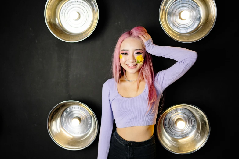 a woman with pink hair posing for a picture, an album cover, trending on pexels, antipodeans, lights inside, wearing yellow croptop, qifeng lin, taken with sony alpha 9