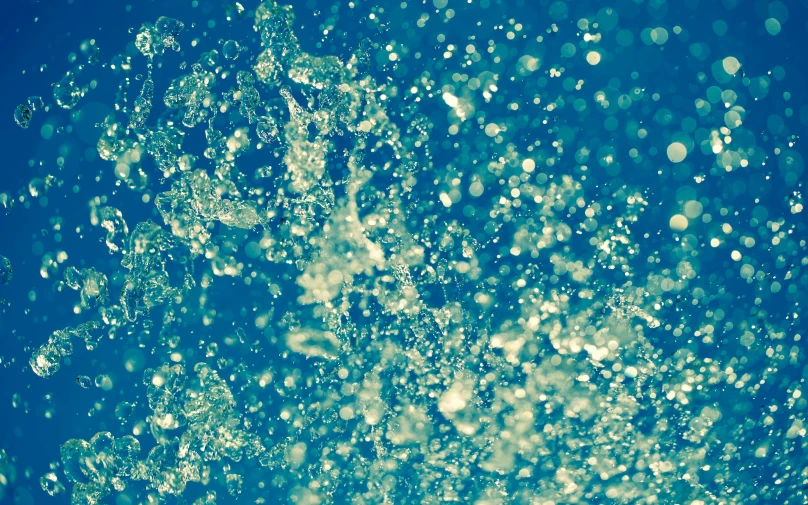 a bunch of bubbles that are in the air, an album cover, pexels, water is made of stardust, grainy vintage, yellow and blue and cyan, shiny wet skin!!