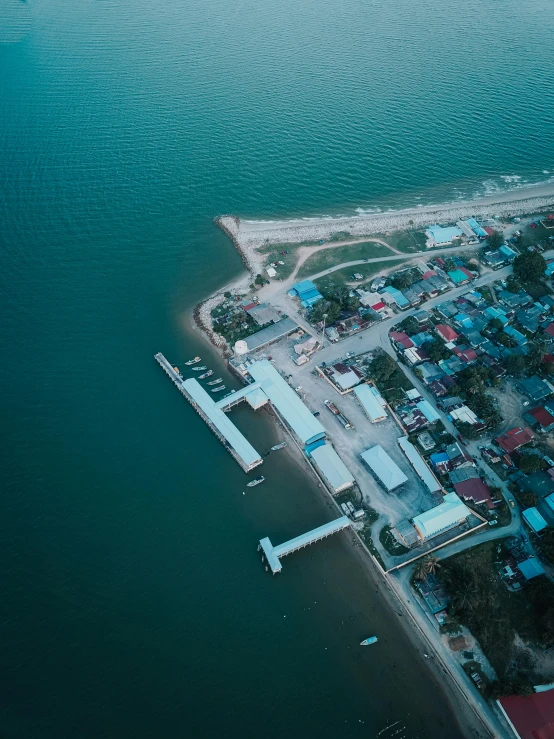 a small island in the middle of a body of water, pexels contest winner, shipyard, beachfront, cinematic lut, high quality image”