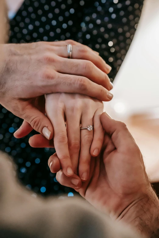 a close up of a person holding a person's hand, men and women, sparkly, thumbnail, professionally taken