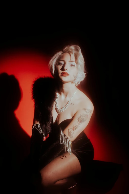 a woman that is sitting down in the dark, an album cover, inspired by Elsa Bleda, featured on reddit, photorealism, cruella devil, amber heard, flashy red lights, selena quintanilla perez