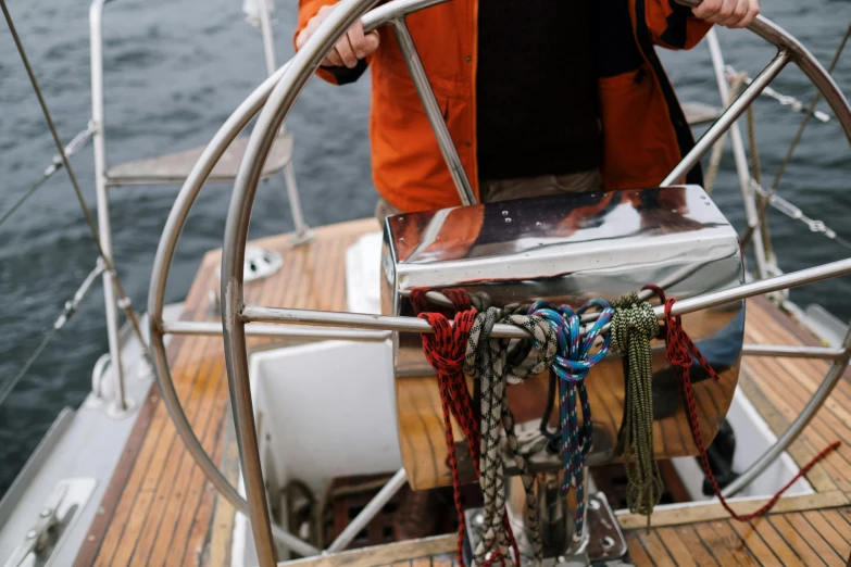 a man standing at the helm of a sailboat, pexels contest winner, paws on steering wheel, coloured, thumbnail, seattle