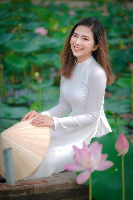 a woman in a white dress is sitting on a boat, inspired by Cui Bai, pexels contest winner, happening, sitting on a lotus flower, ao dai, avatar image, headshot profile picture