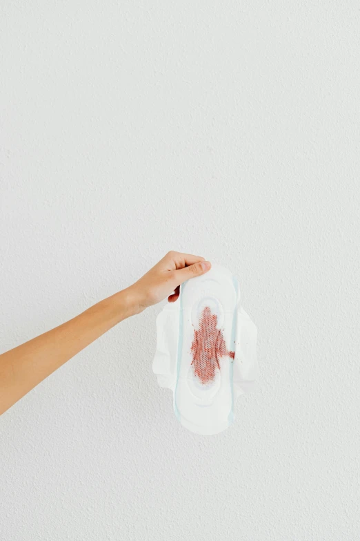 a person holding a piece of paper with a blood stain on it, panties, porcelain organic tissue, product image, transparent