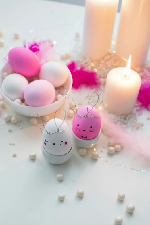 a group of candles sitting on top of a table, a picture, holding easter eggs, white and pink, full product shot, detail shot