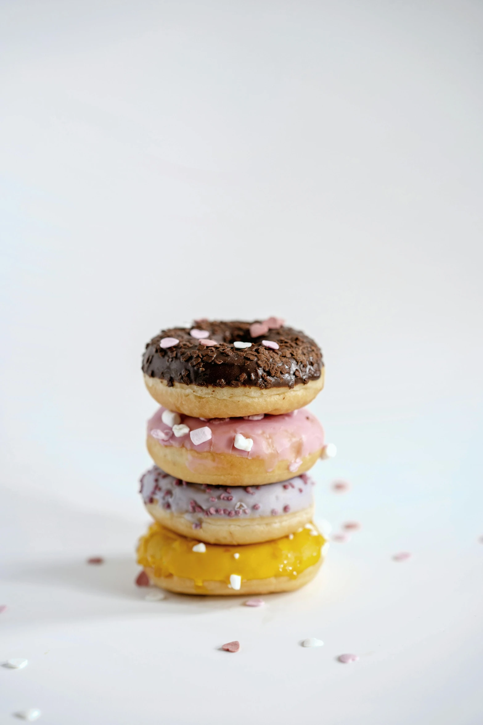 a stack of donuts sitting on top of each other, profile image, dwell, small, candy - coated