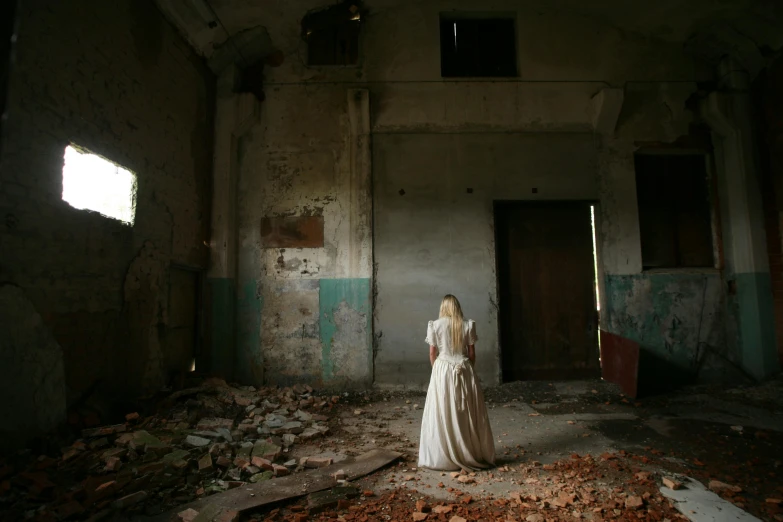 a woman in a white dress standing in an abandoned building, flickr, renaissance, gettyimages, multiple stories, brown, october