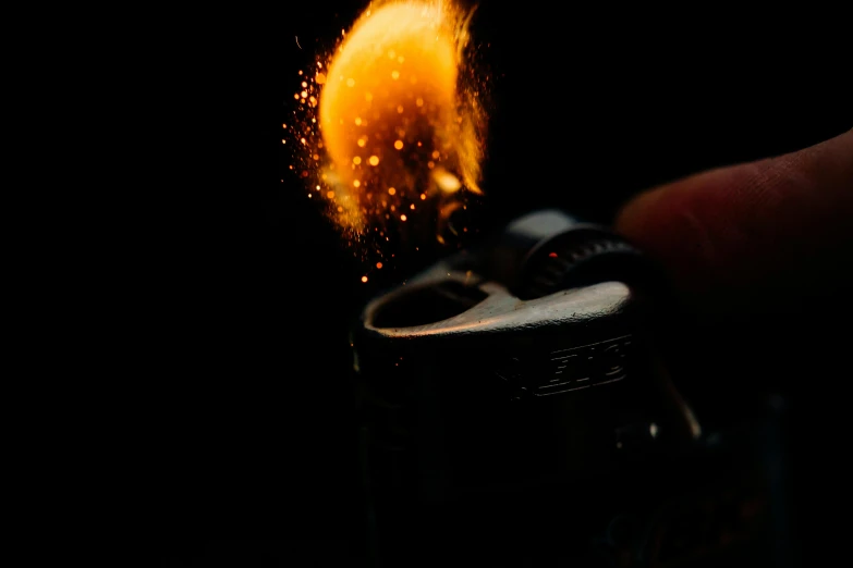 a person holding a lighter in their hand, pexels, hyperrealism, tiny firespitter, high details photo, fan favorite, flames