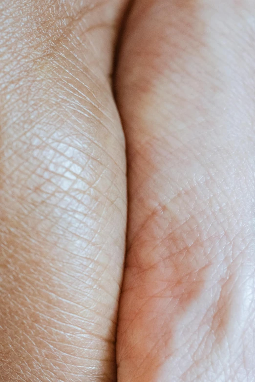 a close up of a person's hand with a diamond ring, a macro photograph, by Adam Marczyński, renaissance, wrinkled muscles skin, facing each other, natural skin tone 4k textures, curved