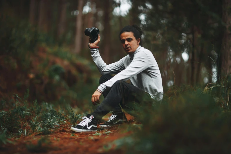 a man taking a picture of himself in the woods, a picture, by Pablo Rey, pexels contest winner, sneaker photo, frank dillane, portrait shot 8 k, youtuber