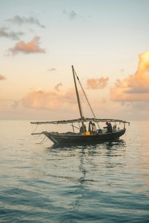 a small boat floating on top of a body of water, hurufiyya, at the sunset, somalia, multiple stories, sail