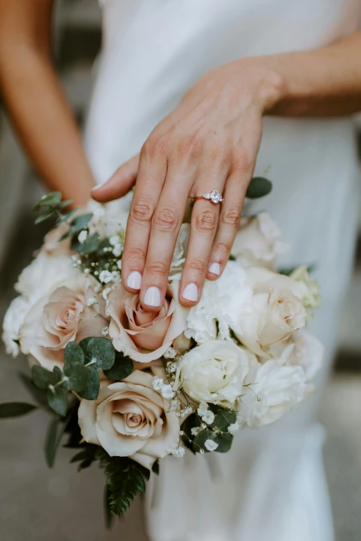 a close up of a person holding a bouquet, ring, multiple stories, pearlized, clean and pristine design