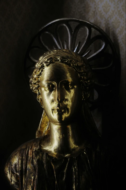 a statue of a woman sitting on top of a chair, inspired by Károly Markó the Elder, pexels contest winner, renaissance, close up head shot, golden treasures on the walls, on the altar, face illuminated