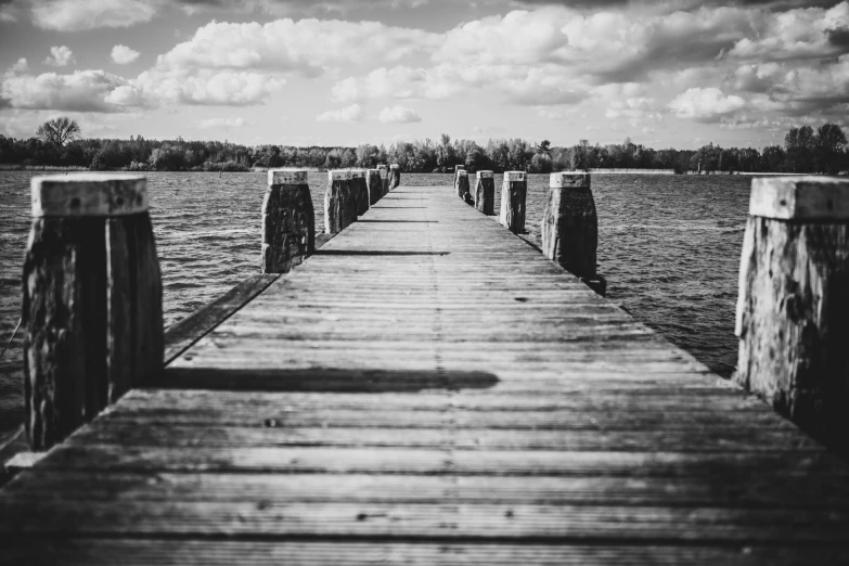 a black and white photo of a pier, a black and white photo, unsplash, visual art, a photo of a lake on a sunny day, pathway, old picture, lowres