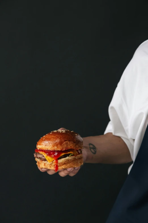 a close up of a person holding a sandwich, deathburger, hegre, holding toasted brioche bun, profile image