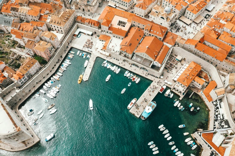 a group of boats floating on top of a body of water, by Matija Jama, pexels contest winner, dubrovnik, square, aerial illustration, sza