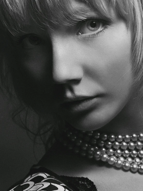 a black and white photo of a woman with a necklace, a black and white photo, trending on cgsociety, photorealism, white bangs, portrait photo of taylor swift, jewelry pearls, tetsuya nomura