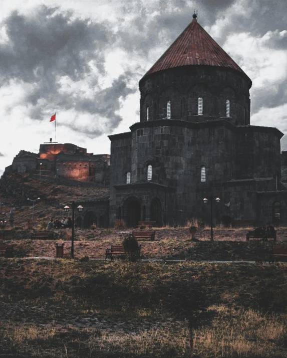 a castle sitting on top of a hill under a cloudy sky, dark building, historically accurate, instagram post, background image