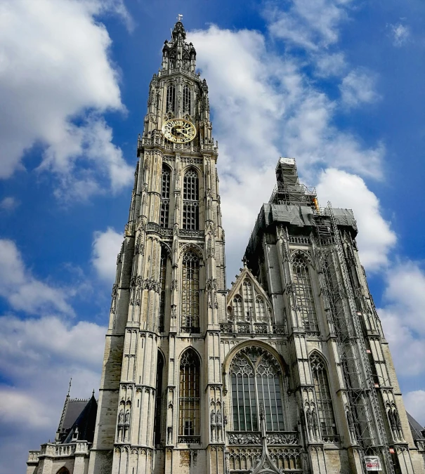 a very tall building with a clock on it's side, by Adriaen Coorte, pexels contest winner, baroque, alabaster gothic cathedral, flanders, marker”, buffalo