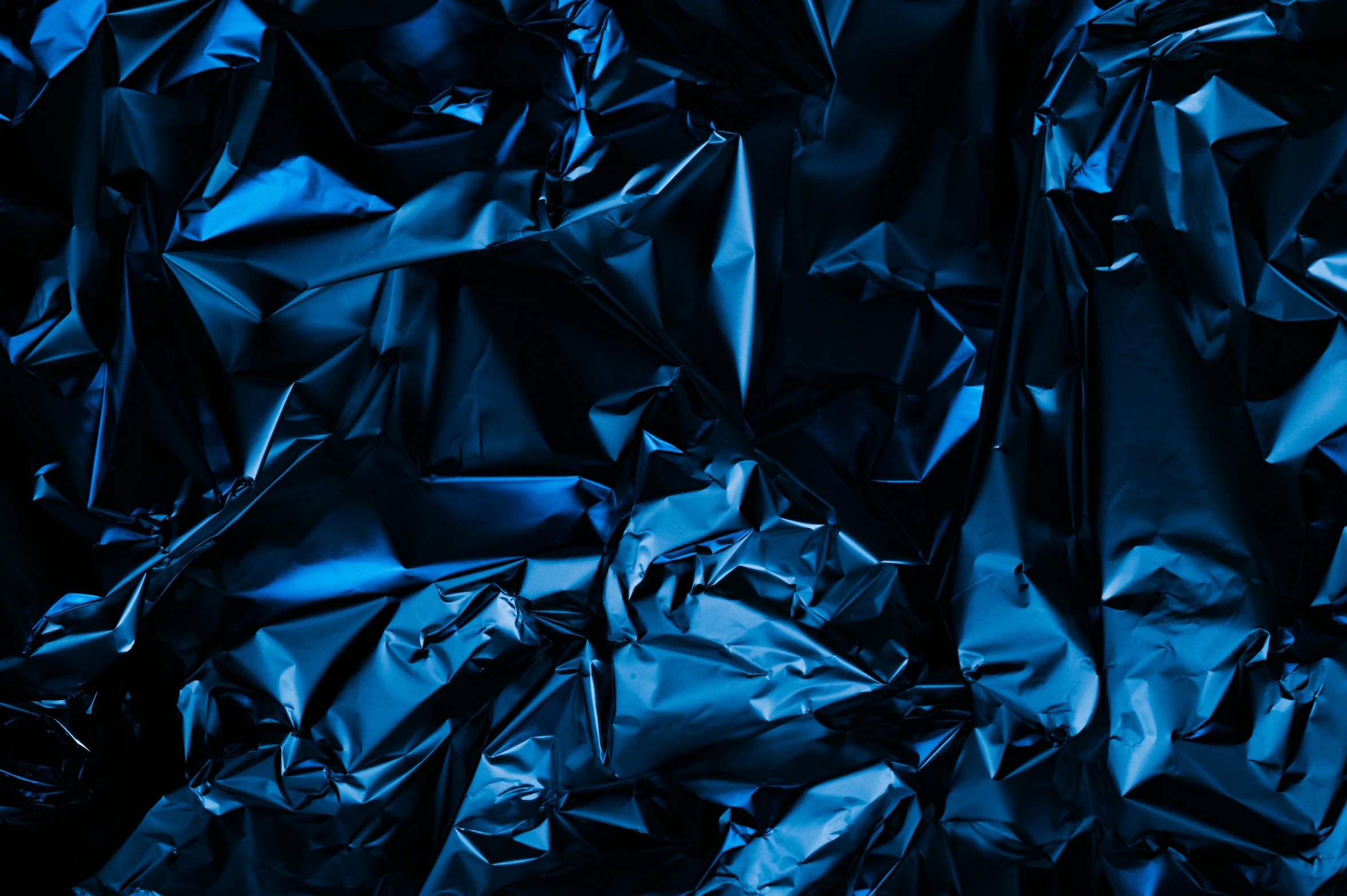 a close up of a sheet of tin foil, an album cover, by Julia Pishtar, pexels contest winner, plasticien, gradient blue black, wallpaper for monitor, navy blue, deep black