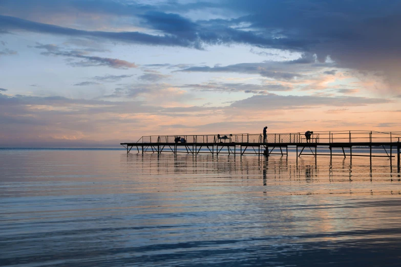 a group of people standing on top of a pier, calm evening, people angling at the edge, near lake baikal, graphic print