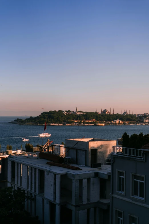 a view of a body of water from a building, by Cafer Bater, hurufiyya, istanbul, goldenhour, high res 8k, panorama