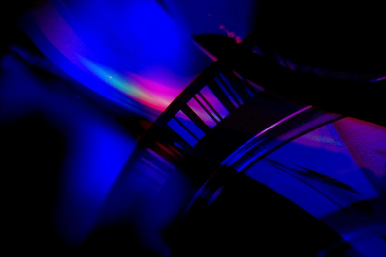 a close up of a piano in a dark room, a microscopic photo, by Doug Ohlson, abstract illusionism, blue purple gradient, dna, blue and red, lensflare