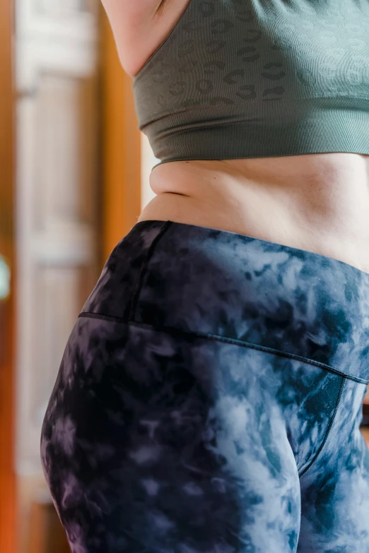 a close up of a person with a cell phone, crop yoga short, widest hips, battle scars across body, background image