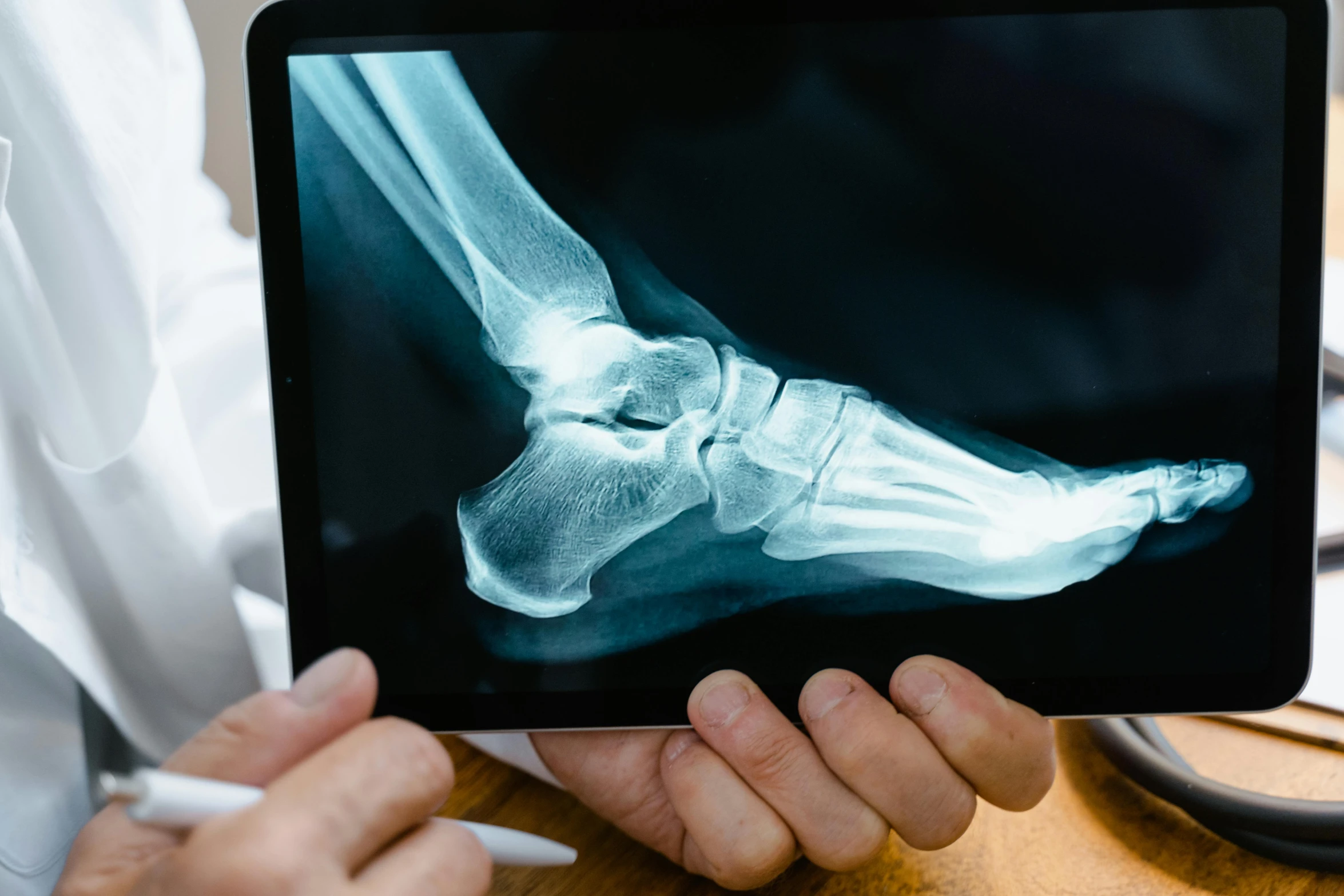 a close up of a person holding a tablet computer, pexels, analytical art, broken bones, foot wraps, med bay, youtube thumbnail