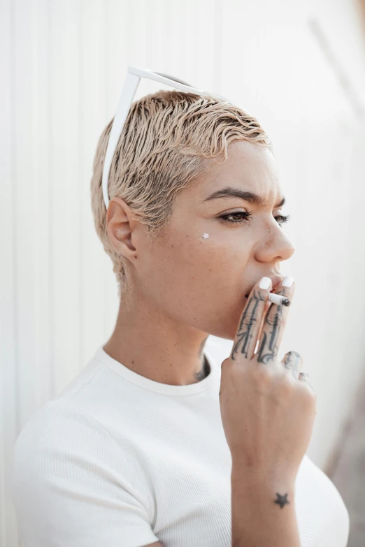 a woman with a cigarette in her mouth, inspired by Elsa Bleda, trending on pexels, short platinum hair tomboy, mixed-race woman, toothpaste refinery, transparent body