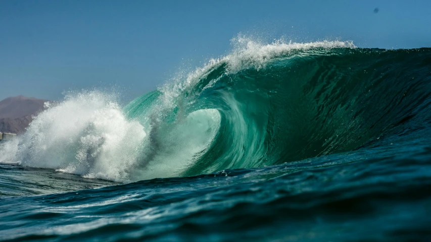 a man riding a wave on top of a surfboard, pexels contest winner, sumatraism, cyan and green, glassy fracture, o'neill cylinder, rectangle