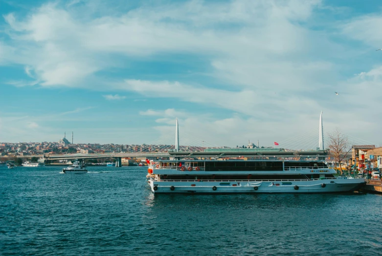 a boat that is sitting in the water, by Julia Pishtar, pexels contest winner, hurufiyya, panorama view, brown, turqouise, subtitles