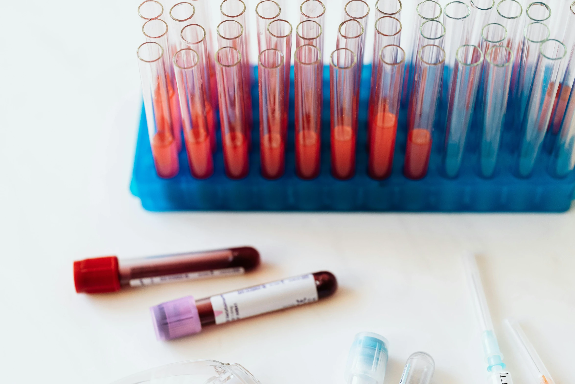 a bunch of test tubes sitting on top of a table, a picture, unsplash, blood smear, red hoods, lipgloss, thin blue arteries