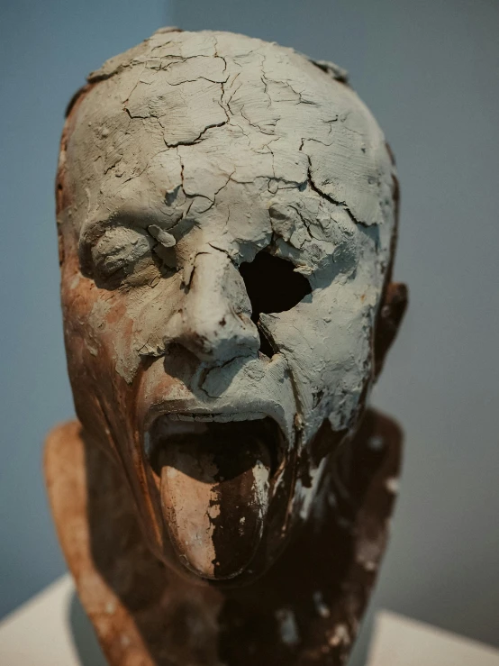 a close up of a clay sculpture of a man's face, inspired by Nicola Samori, unsplash, screaming in agony, rusted silent hill, on display in a museum, full view of face and body