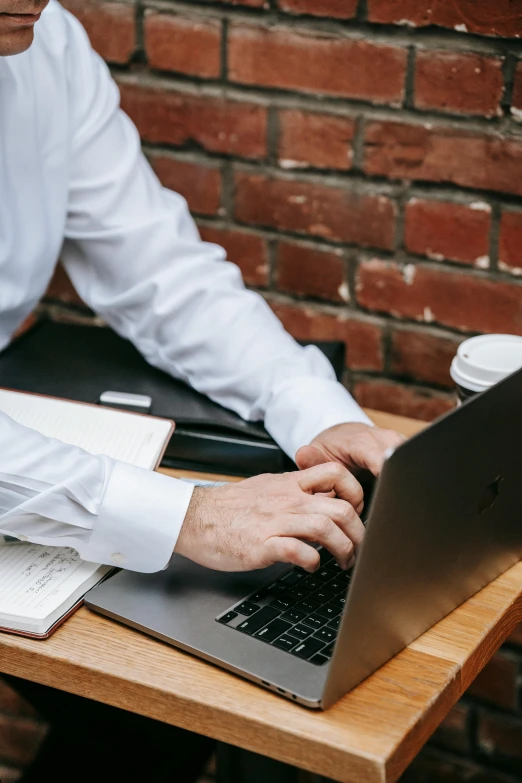 a man sitting at a table using a laptop computer, trending on unsplash, private press, lawyer clothing, finely textured, white, schools