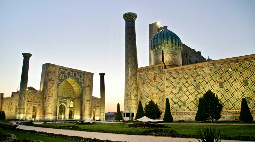 a large building with a green dome on top of it, hurufiyya, big towers, samarkand, conde nast traveler photo, square