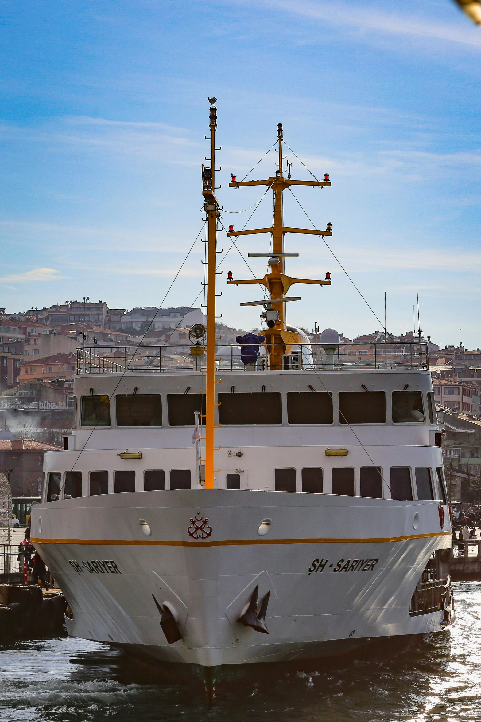 a large white boat floating on top of a body of water, lisbon, rugged ship captain, silver and yellow color scheme, jsrf