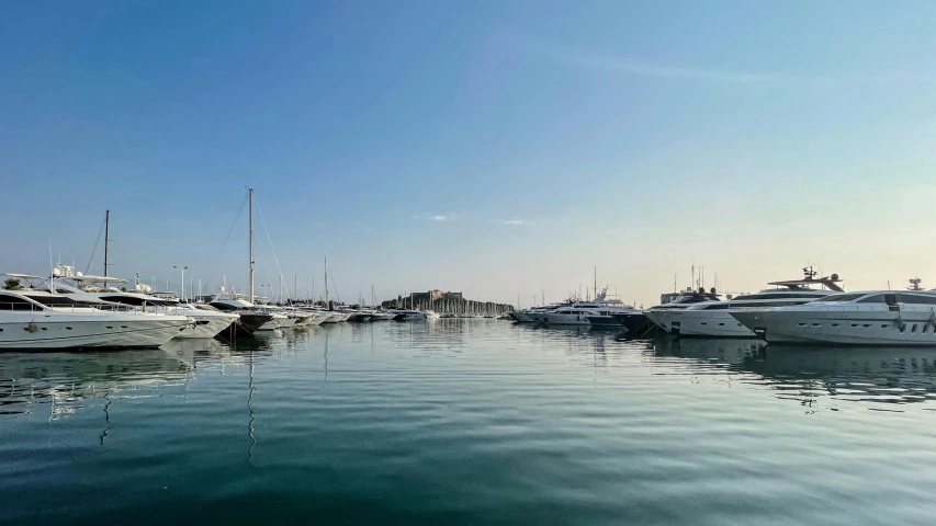 a number of boats in a body of water, pexels contest winner, les nabis, cannes, fan favorite, calm water, low-angle shot