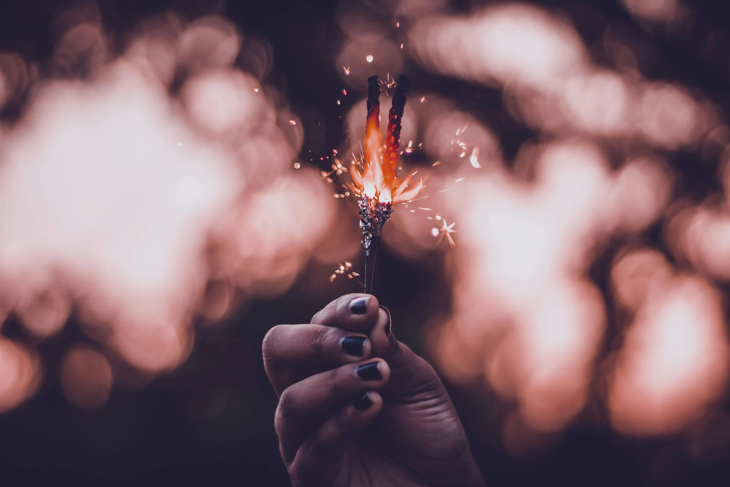 a person holding a sparkler in their hand, an album cover, pexels contest winner, magical realism, tiny firespitter, about to consume you, profile image, welding torches for arms