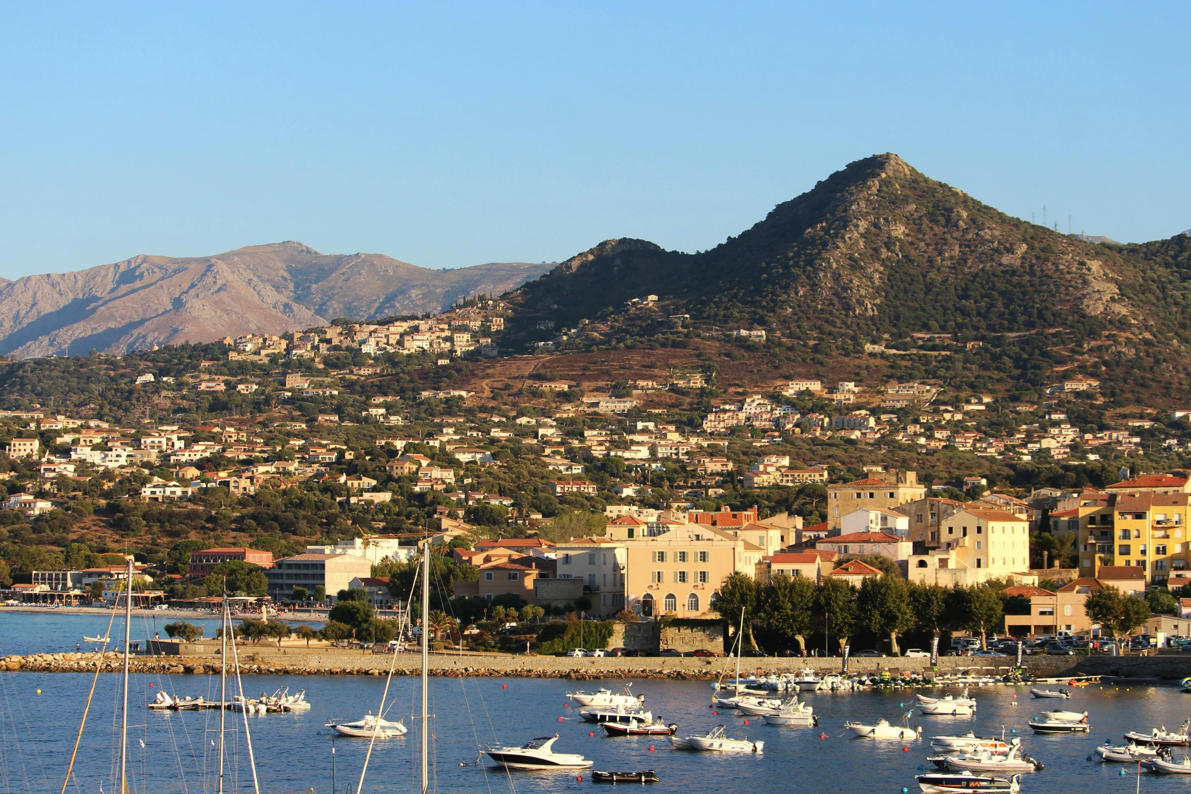 a large body of water filled with lots of boats, pexels contest winner, renaissance, traditional corsican, hills in the background, mid morning lighting, brown