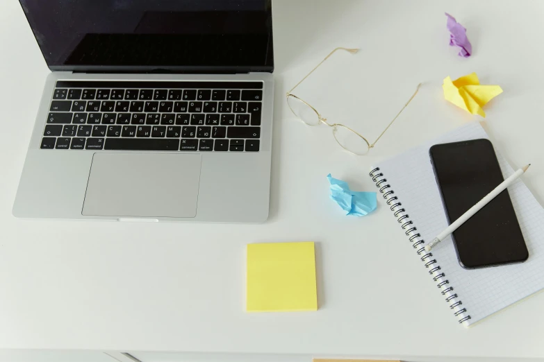 a laptop computer sitting on top of a white desk, trending on pexels, notes, white and yellow scheme, fluorescent, rectangle