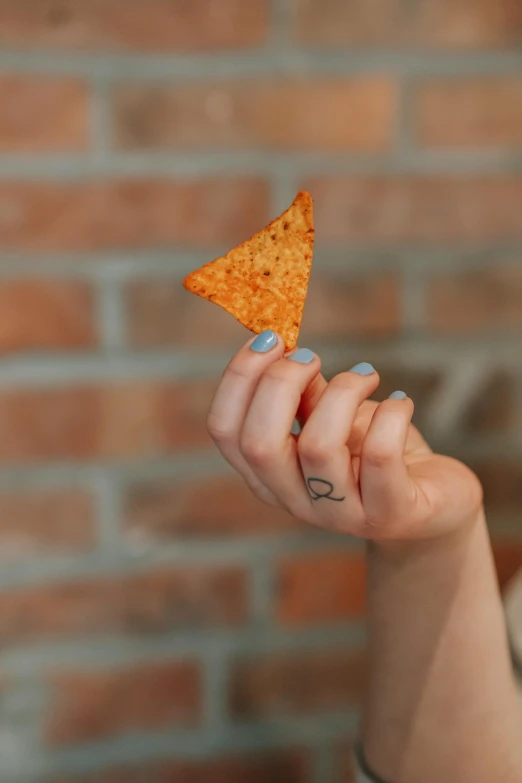 a woman holding a tortilla chip in front of her face, pexels, photorealism, back - shot, large)}], geometrically realistic, pepper