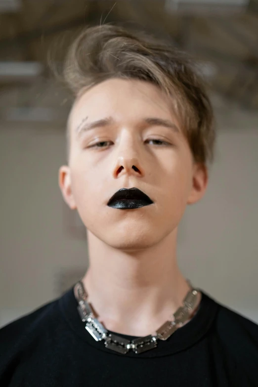 a young man with a fake mustache on his face, inspired by Bálint Kiss, reddit, visual art, shiny black lipstick, black teenage boy, genderless, pointé pose;pursed lips